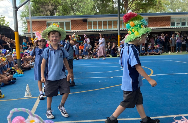 Two male students in Easter hat parade